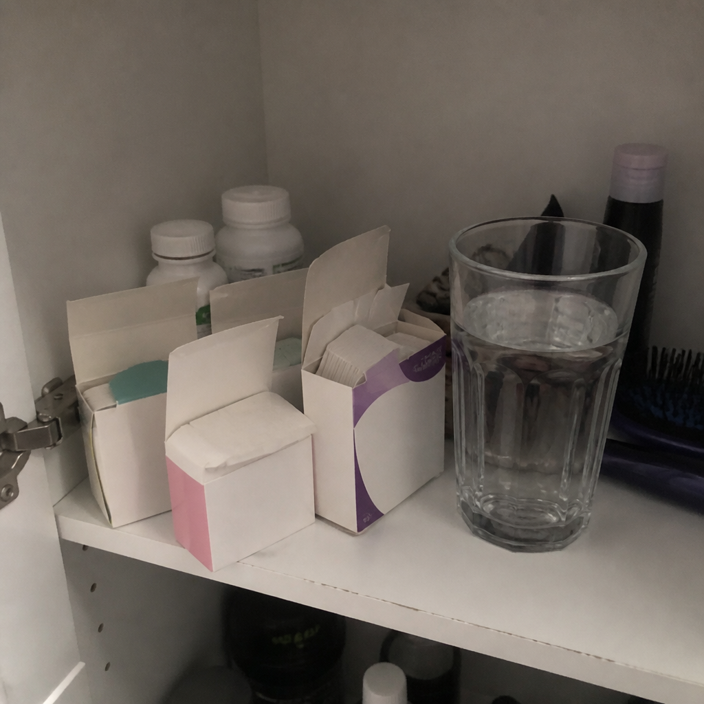 Boxes of hormone medication clustered on a shelf